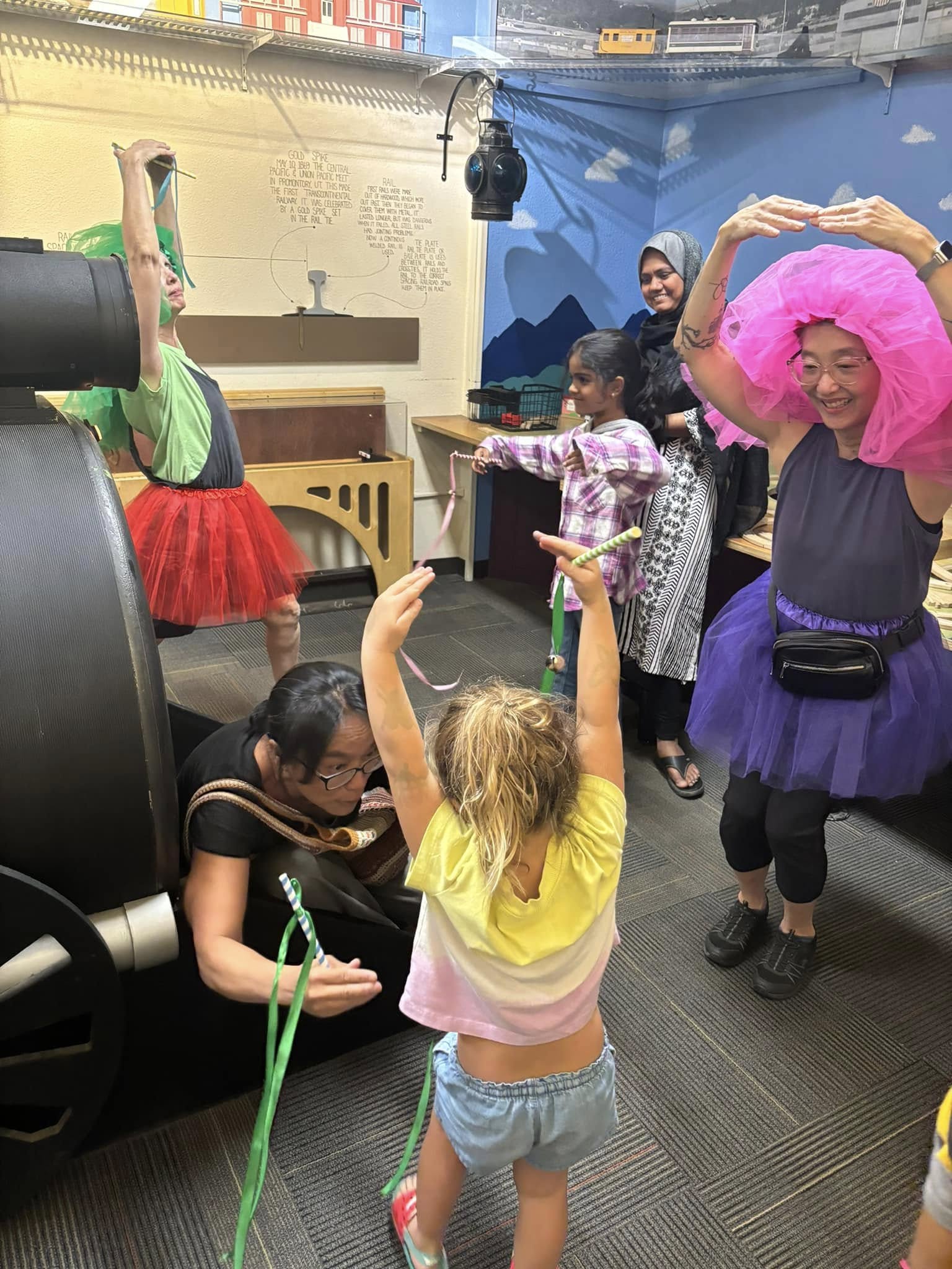 Dancesequences facilitators leading a creative movement workshop at a children's museum